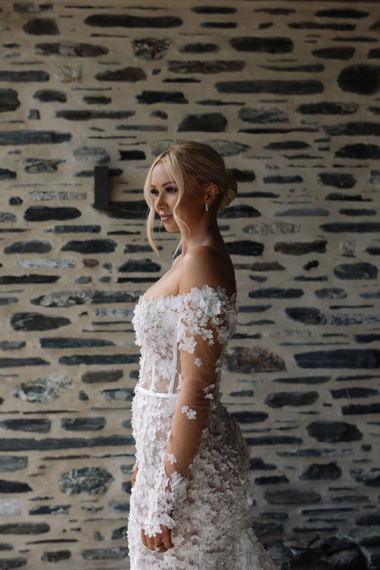 Sleek platinum low bun with face-framing pieces